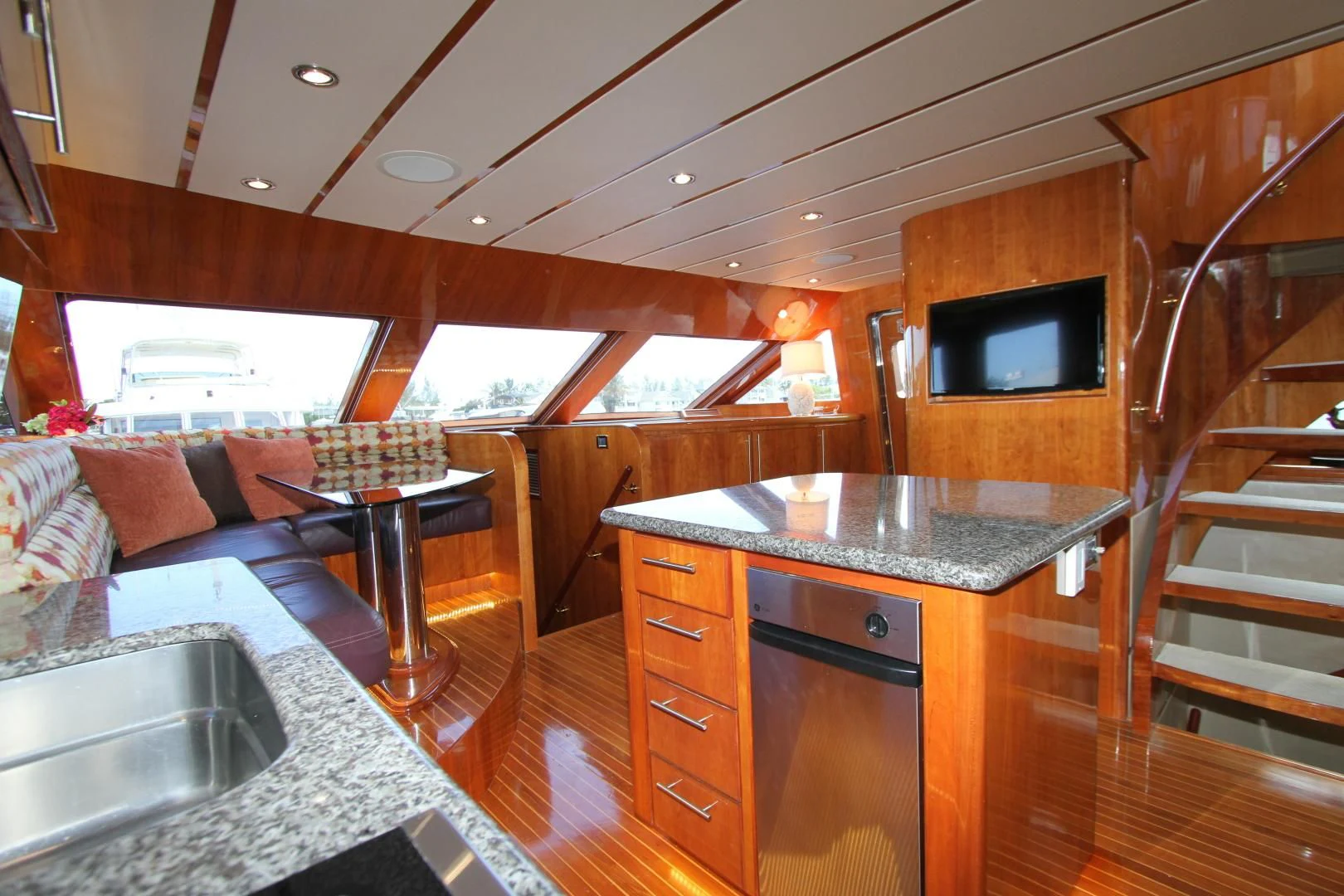a kitchen with a sink and a tv in the background aboard KISMET Yacht for Sale