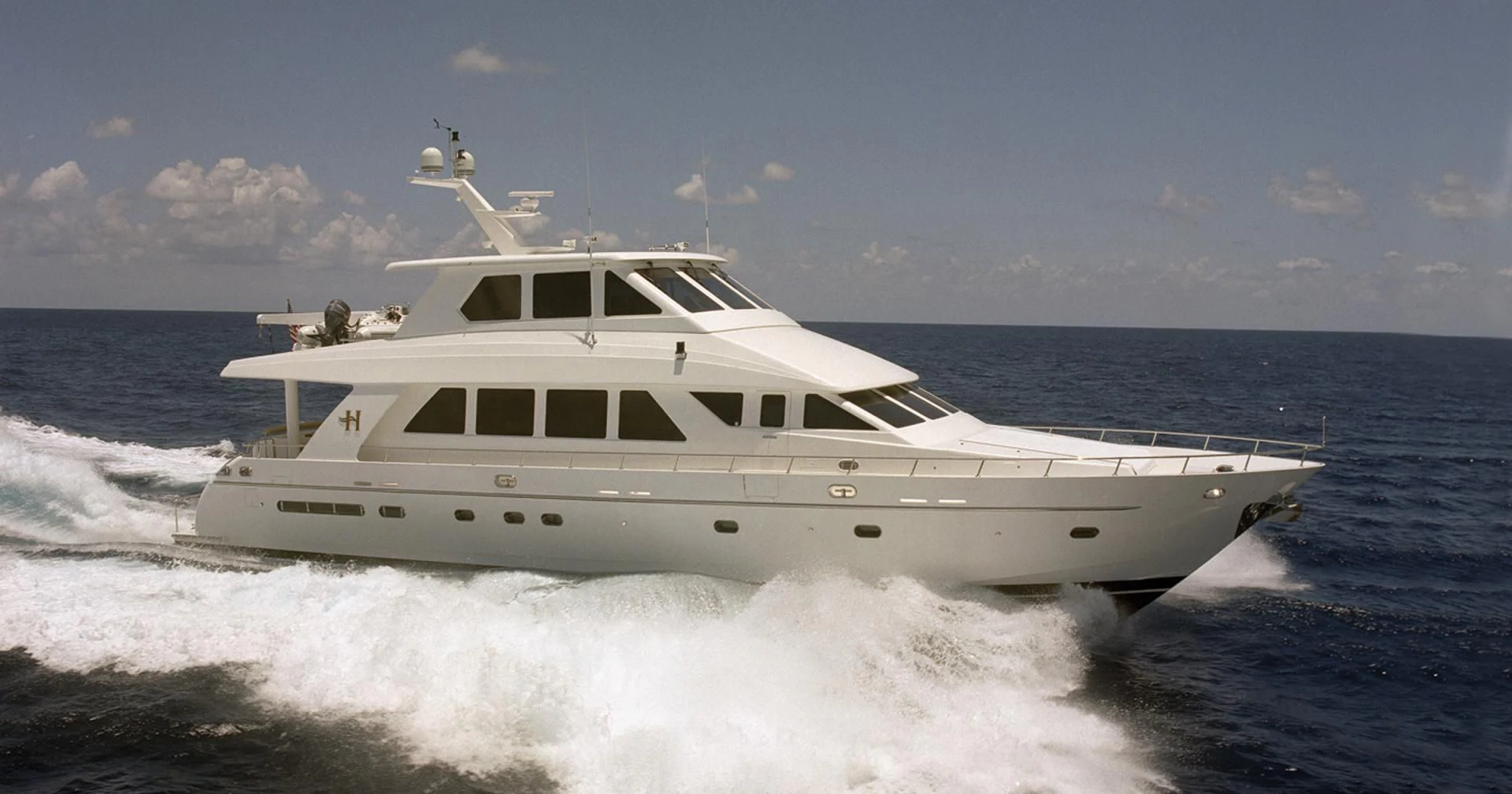 a white yacht on the water aboard KISMET Yacht for Sale