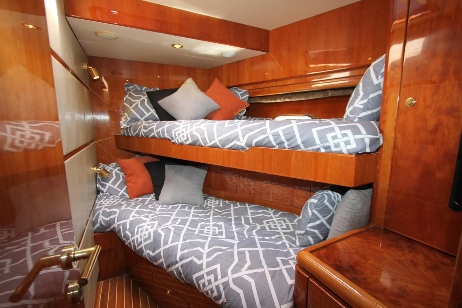 a bed with a white sheet and pillows on it aboard KISMET Yacht for Sale