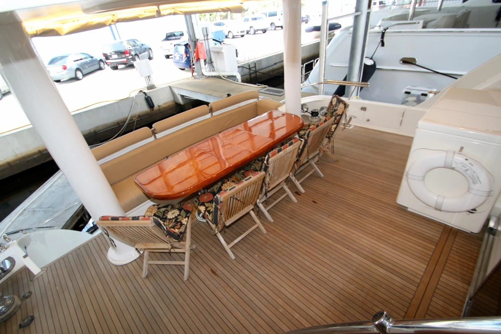 a wooden boat on a wooden deck aboard KISMET Yacht for Sale
