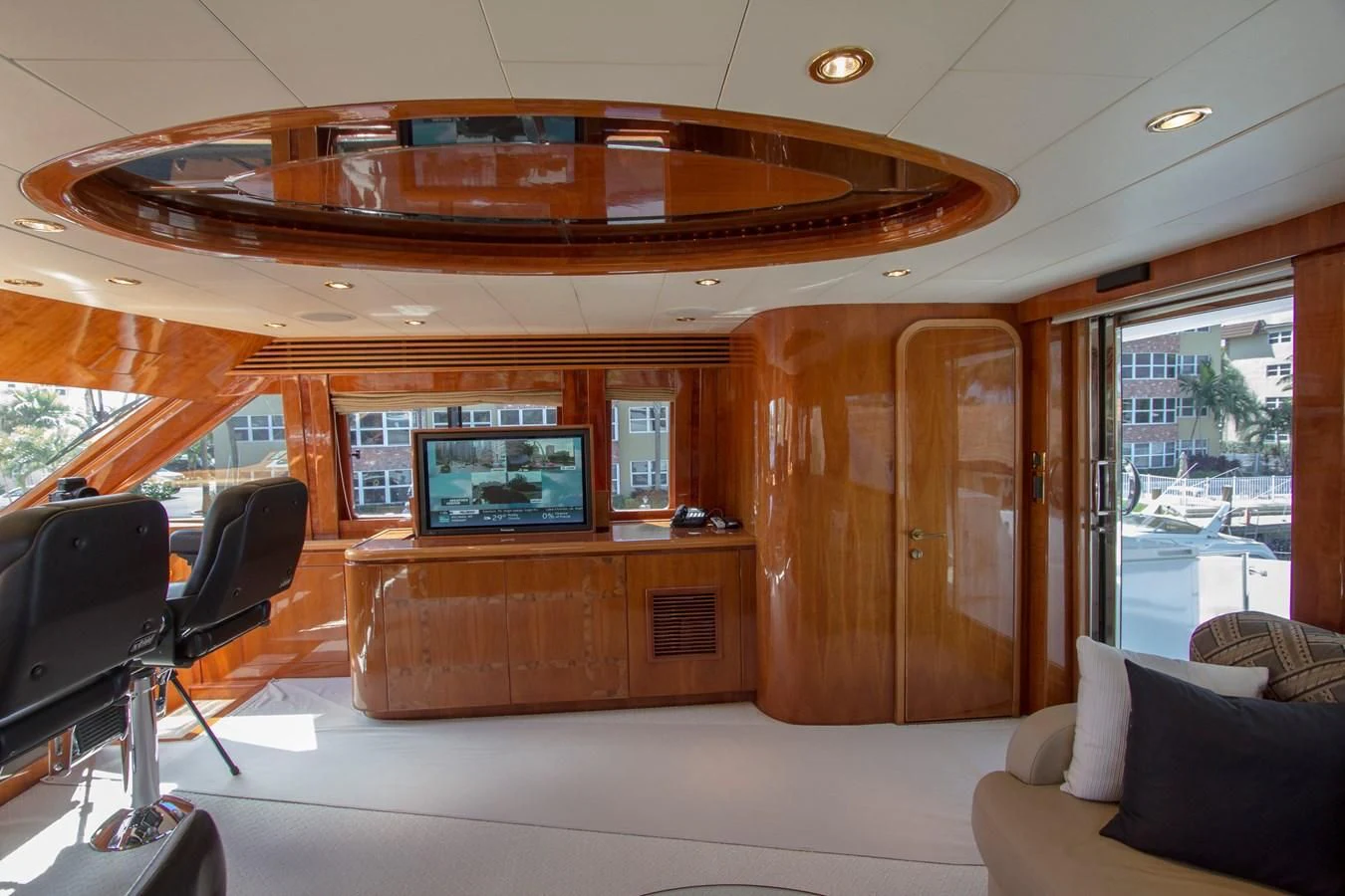 a room with a tv and a couch aboard KISMET Yacht for Sale