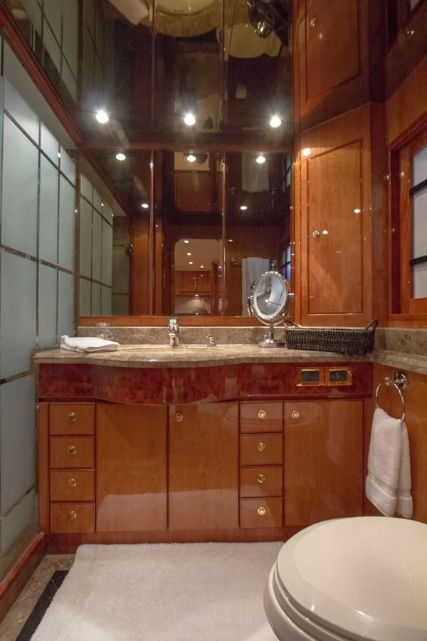 a bathroom with a large mirror aboard KISMET Yacht for Sale