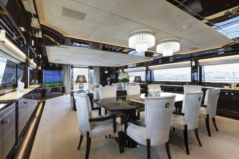 a room with tables and chairs aboard ELSEA Yacht for Sale