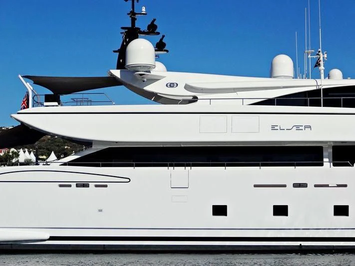 a white yacht with a bell on the front aboard ELSEA Yacht for Sale