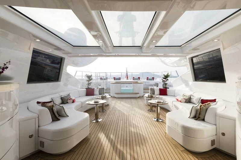 a large living room with a large screen aboard ELSEA Yacht for Sale