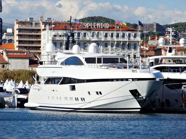 a large white yacht in a harbor aboard ELSEA Yacht for Sale