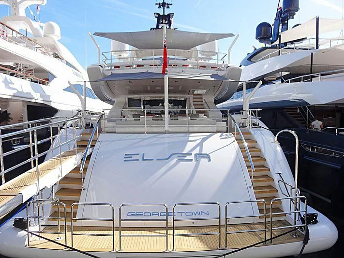 a large white ship with a red stripe on the deck aboard ELSEA Yacht for Sale