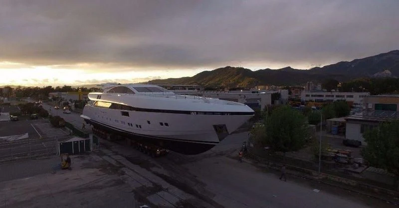 a large white ship in a harbor aboard ELSEA Yacht for Sale