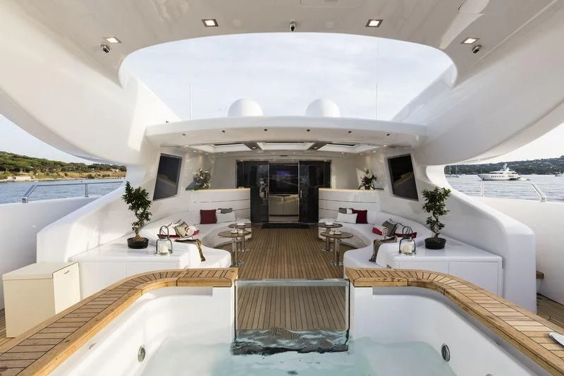 a large room with a pool table and chairs aboard ELSEA Yacht for Sale