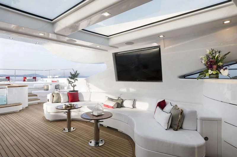 a living room with a large screen aboard ELSEA Yacht for Sale
