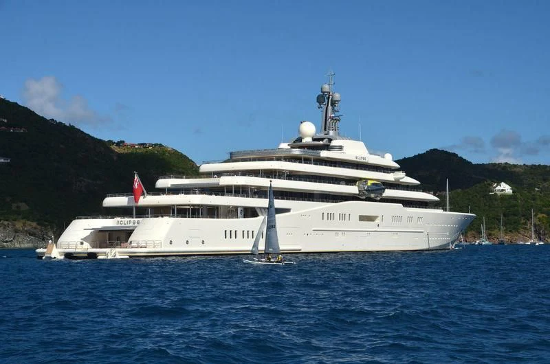 a large white yacht on the water aboard ECLIPSE Yacht for Sale