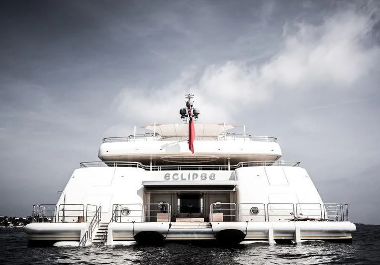 a large white boat on the beach aboard ECLIPSE Yacht for Sale