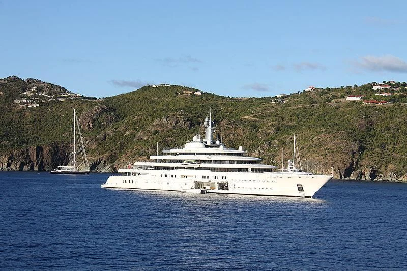 a large white boat on the water aboard ECLIPSE Yacht for Sale
