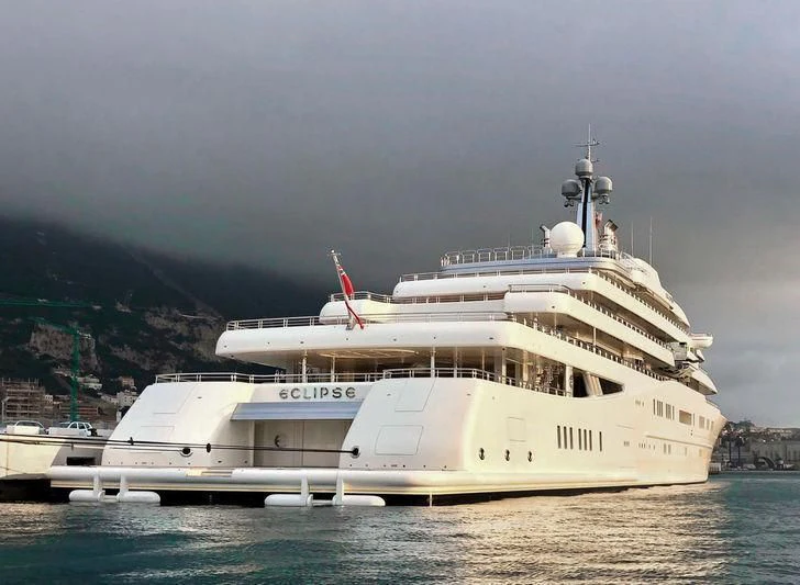 a large white boat in the water aboard ECLIPSE Yacht for Sale