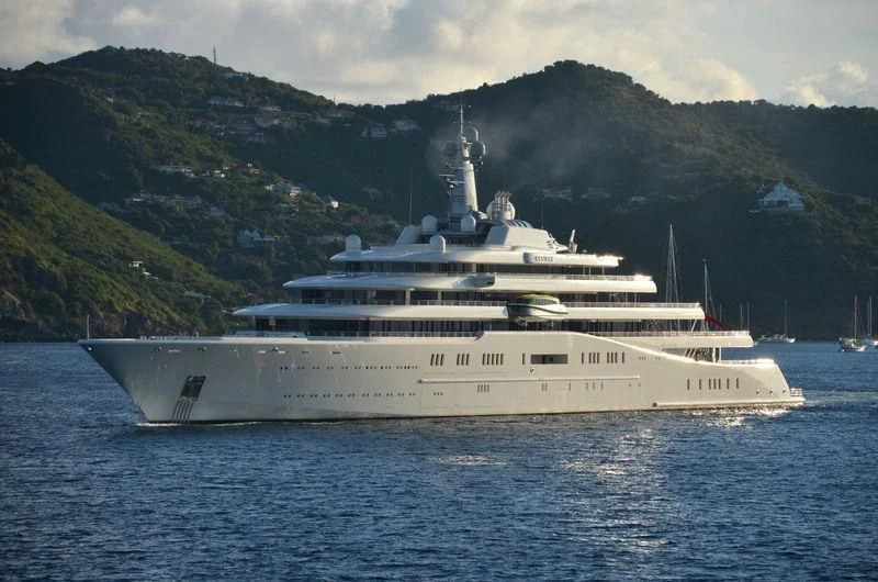 a large white boat in the water aboard ECLIPSE Yacht for Sale