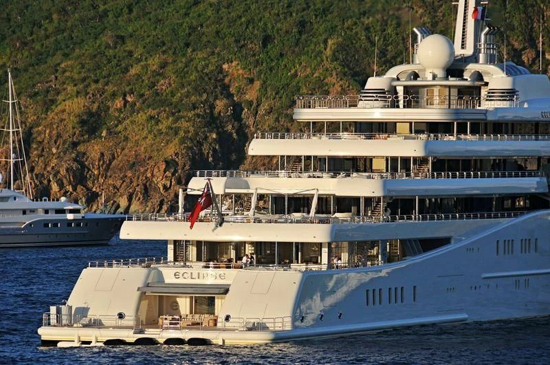 a large white boat in the water aboard ECLIPSE Yacht for Sale