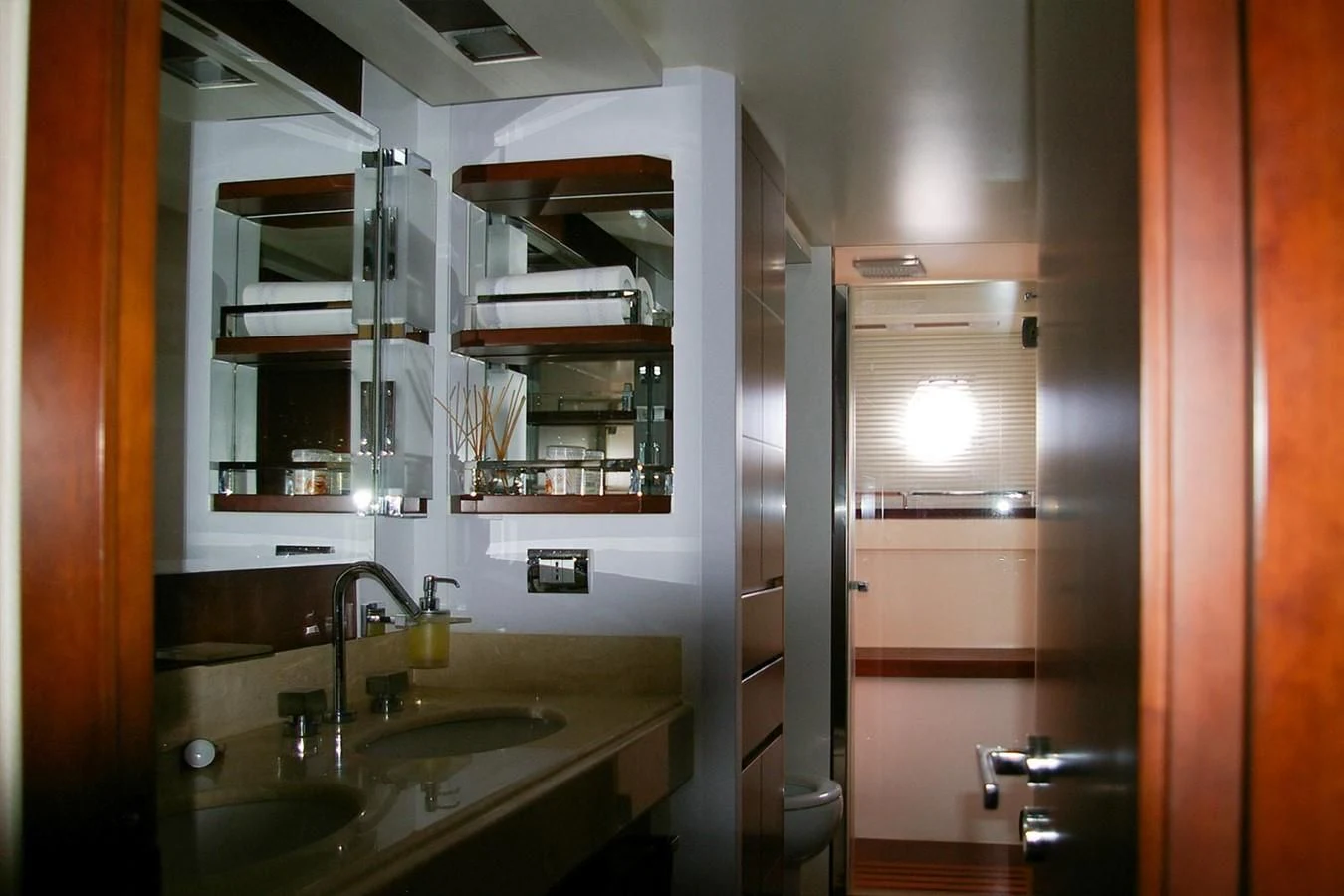 a bathroom with a sink and a mirror aboard VICTORIA V Yacht for Sale