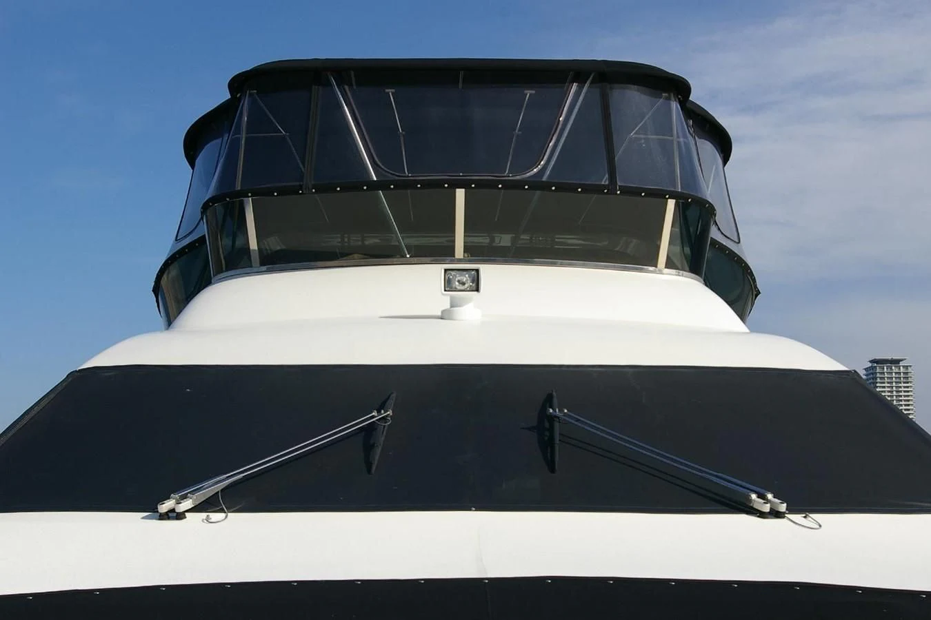 a white yacht with a black canopy aboard VICTORIA V Yacht for Sale