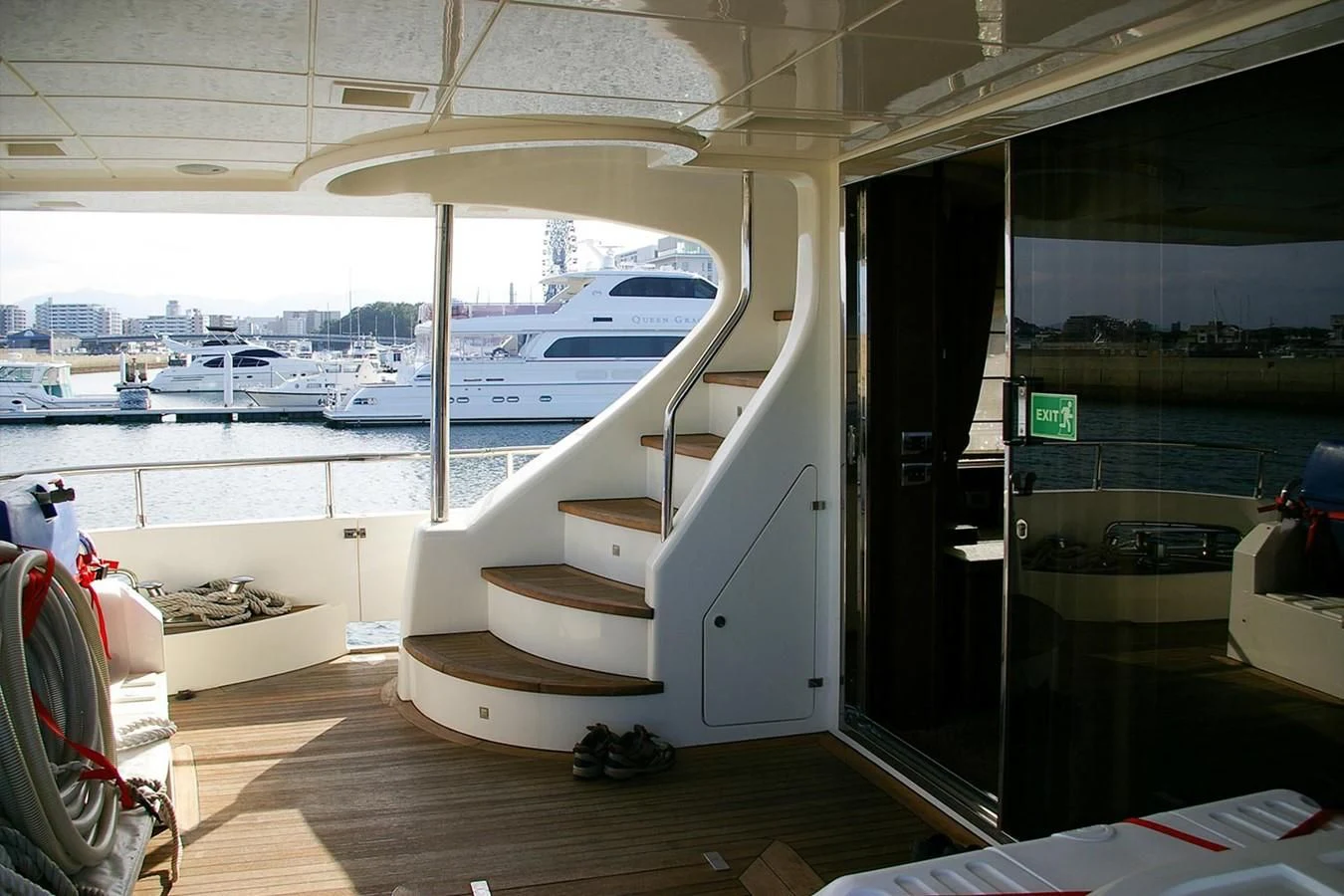 a room with a staircase and a window with a view of the water aboard VICTORIA V Yacht for Sale