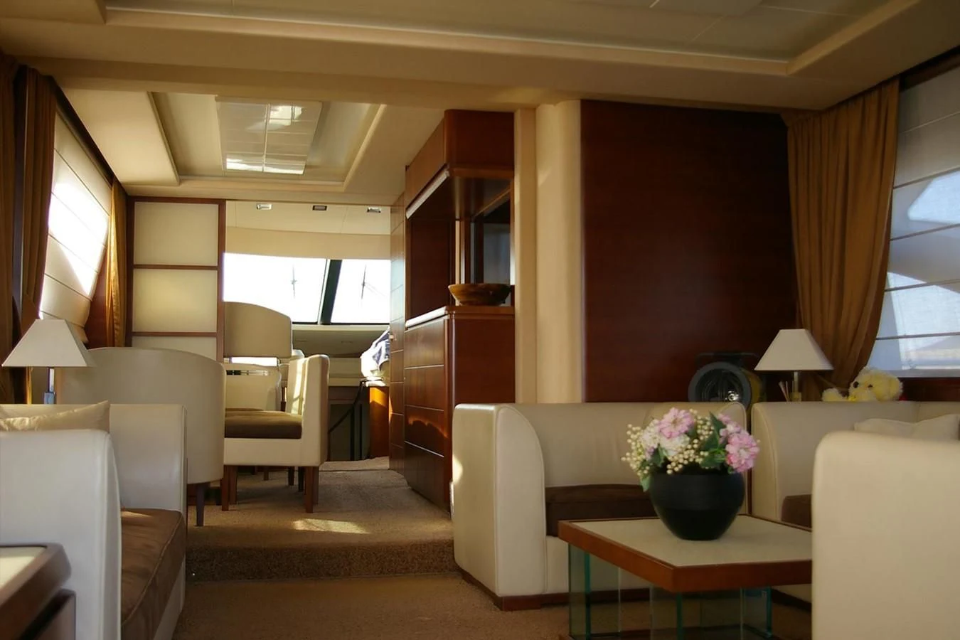 a living room with a couch and a table aboard VICTORIA V Yacht for Sale