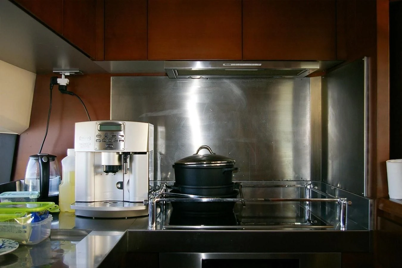 a kitchen with a stove and a coffee maker aboard VICTORIA V Yacht for Sale