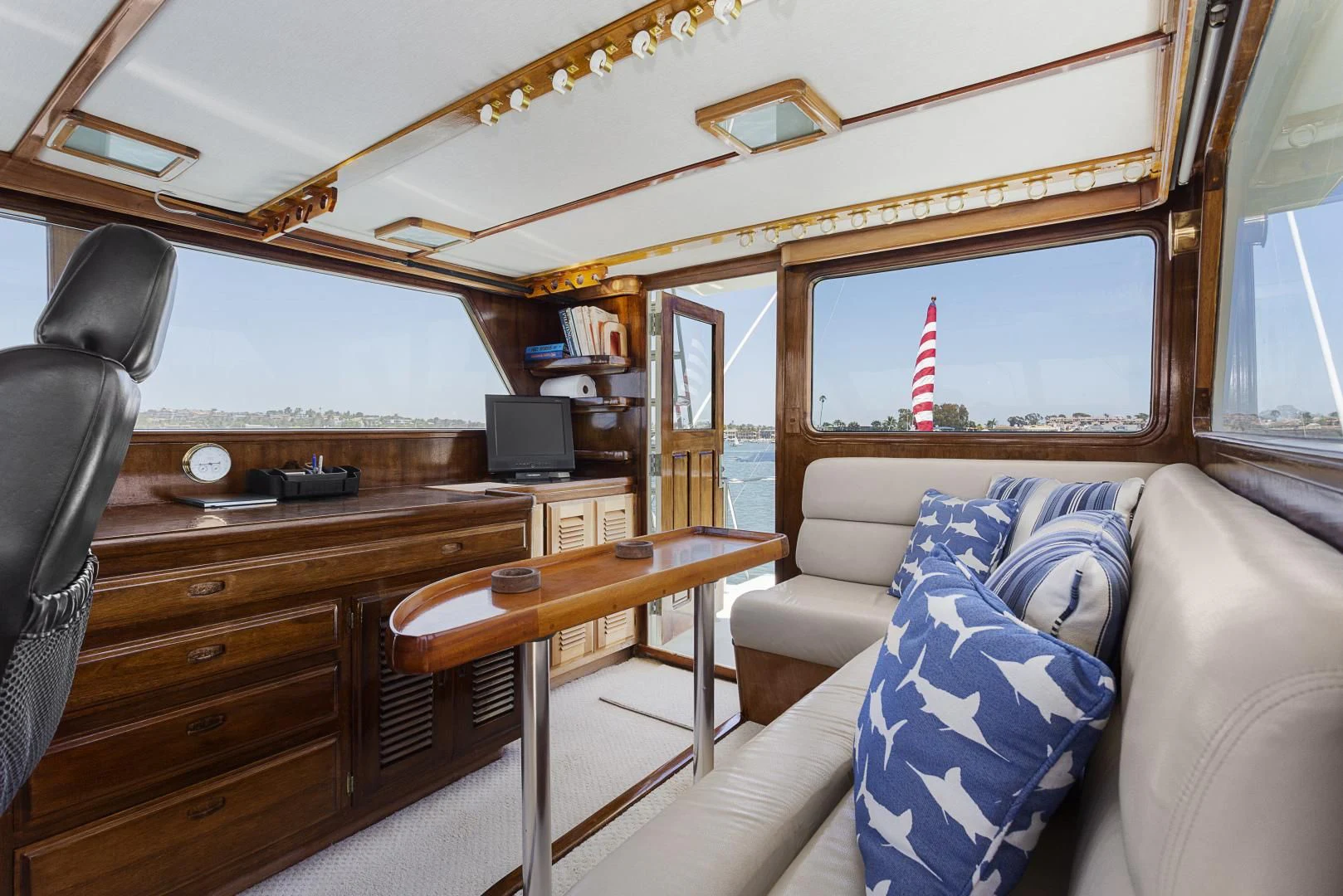 a living room with a couch and a desk aboard EL AMO Yacht for Sale
