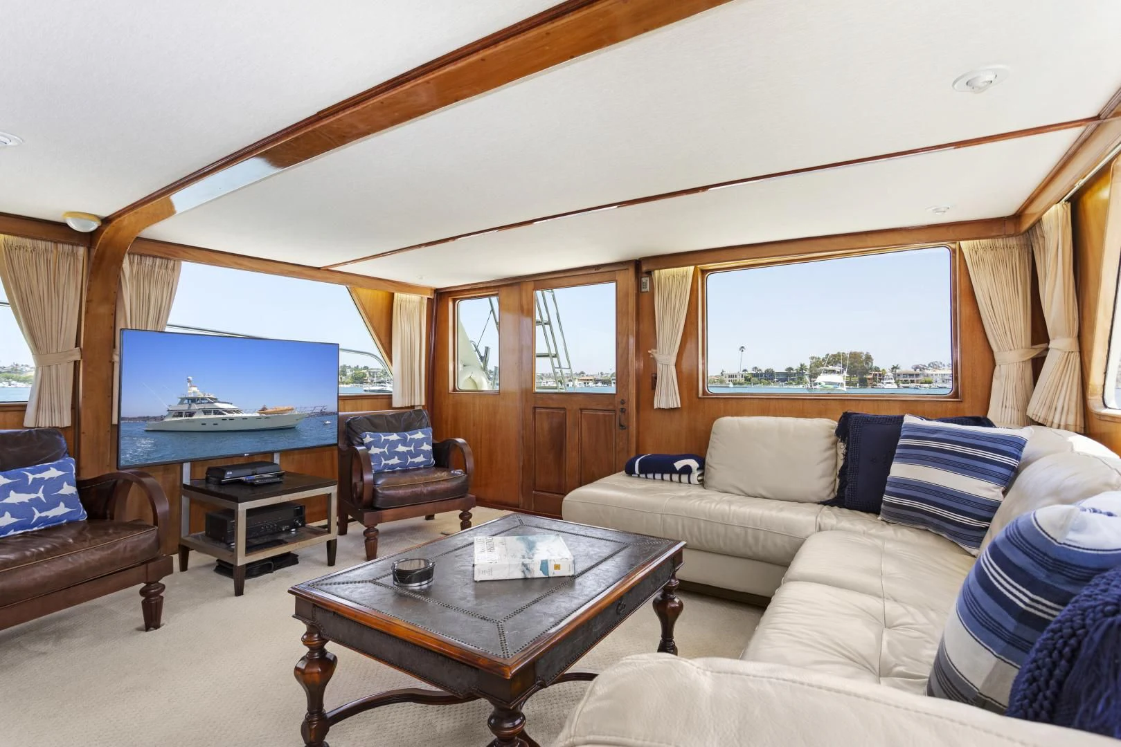 a living room with a large window aboard EL AMO Yacht for Sale