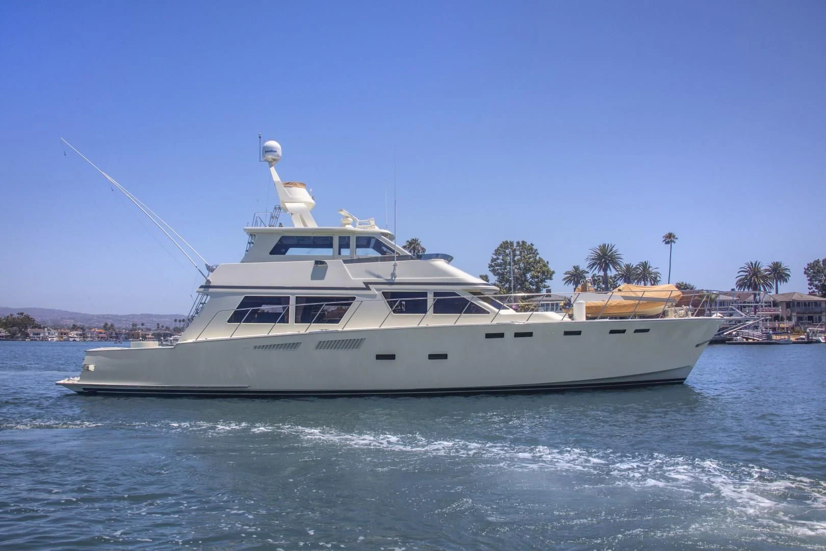 a white boat with a bird on top of it aboard EL AMO Yacht for Sale