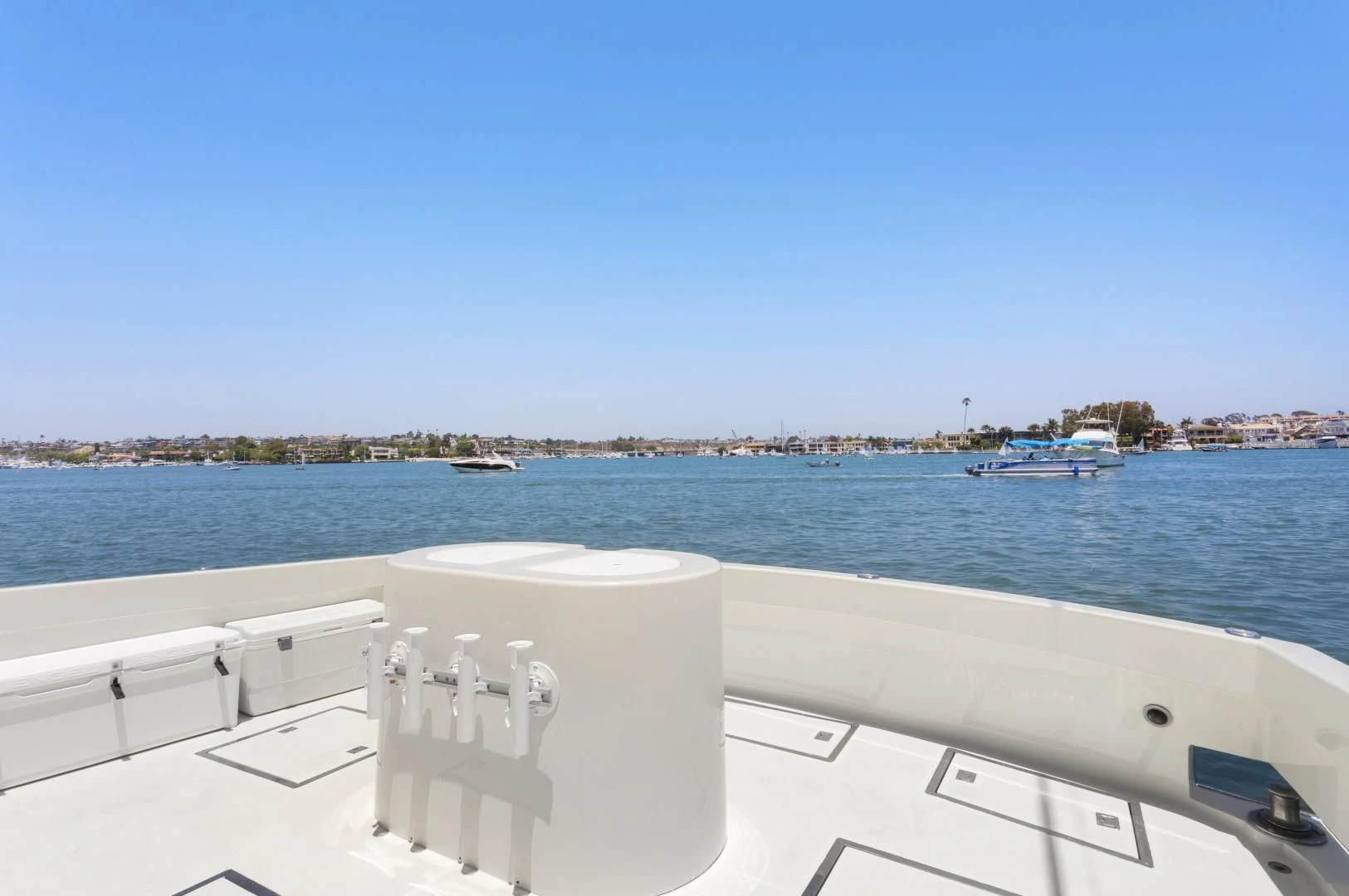 a white boat on a body of water aboard EL AMO Yacht for Sale