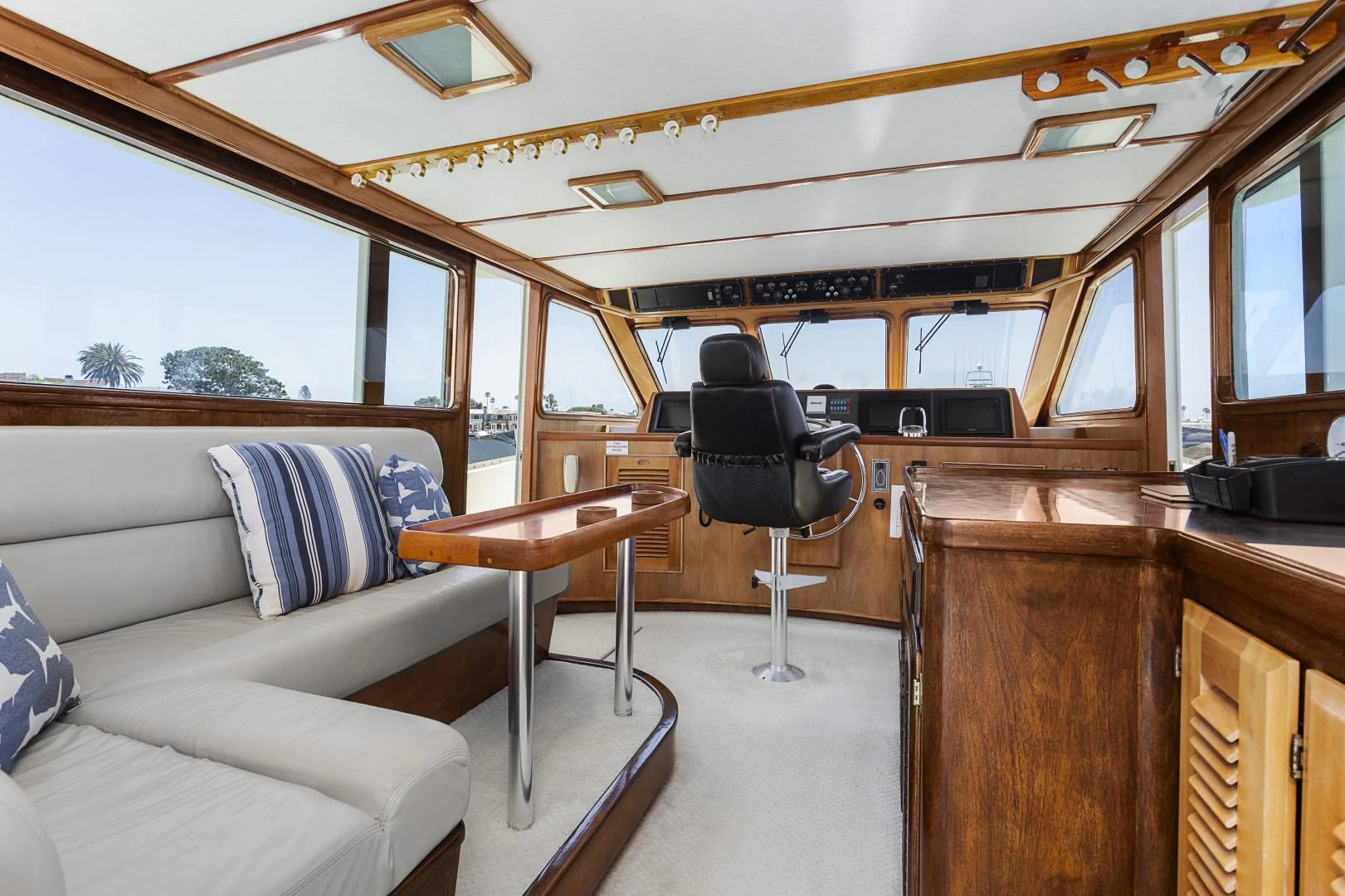a boat with a desk and a chair aboard EL AMO Yacht for Sale