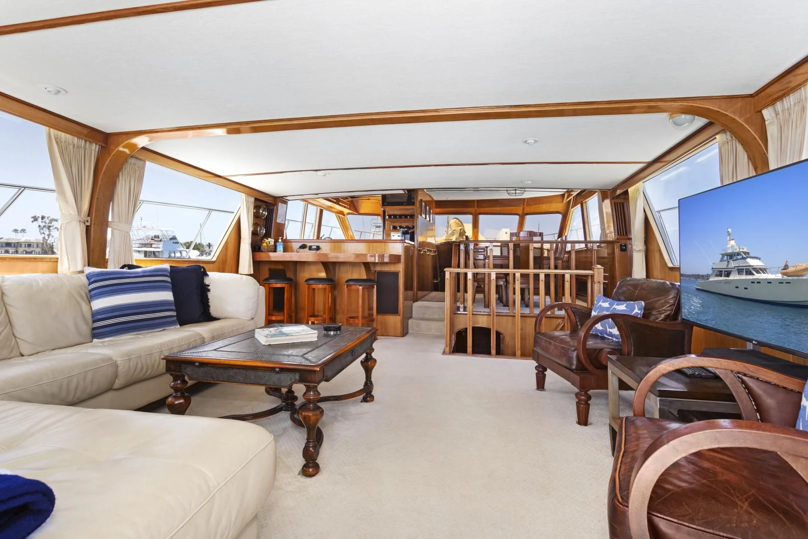 a living room with a couch and a table aboard EL AMO Yacht for Sale