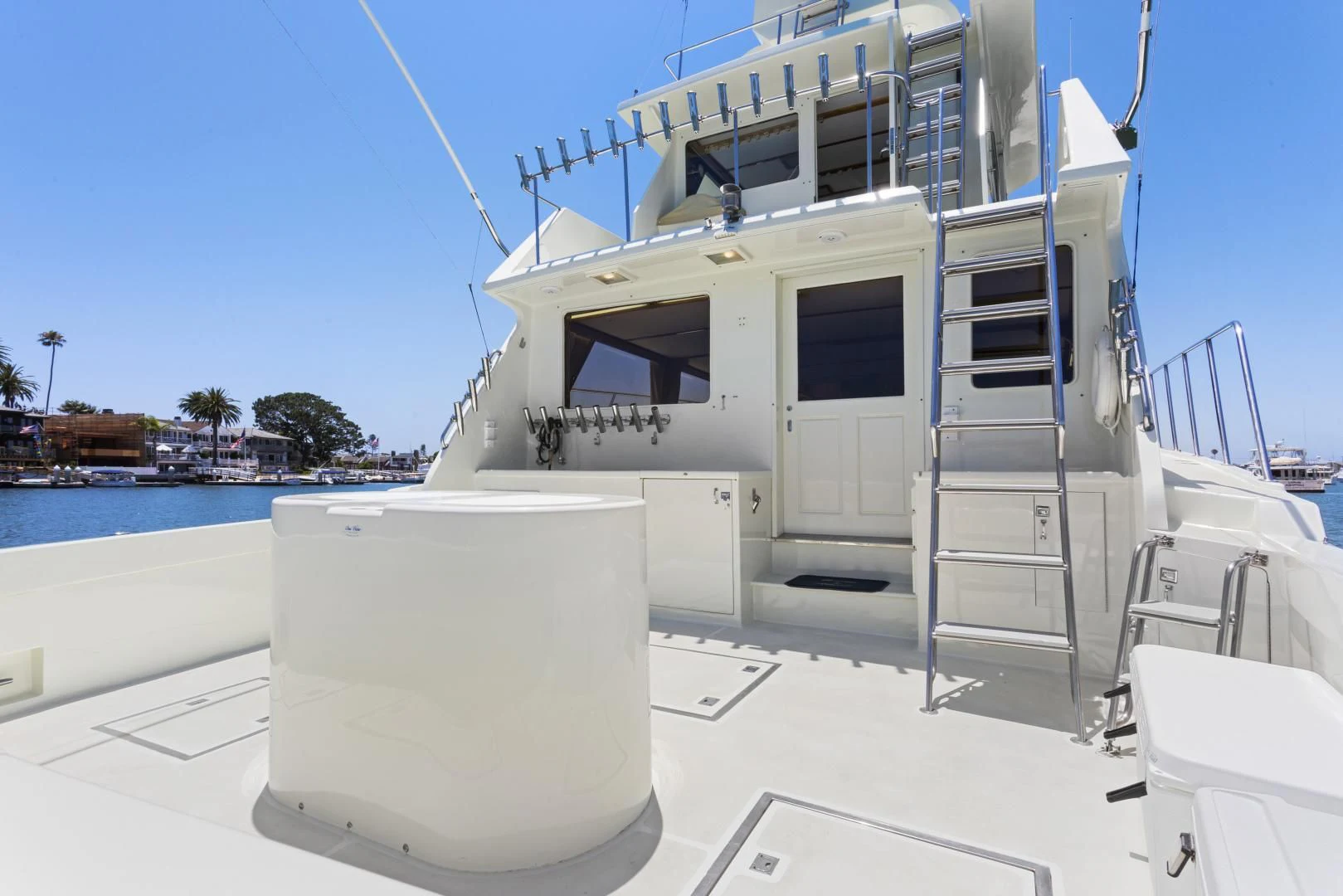 a white boat on a dock aboard EL AMO Yacht for Sale