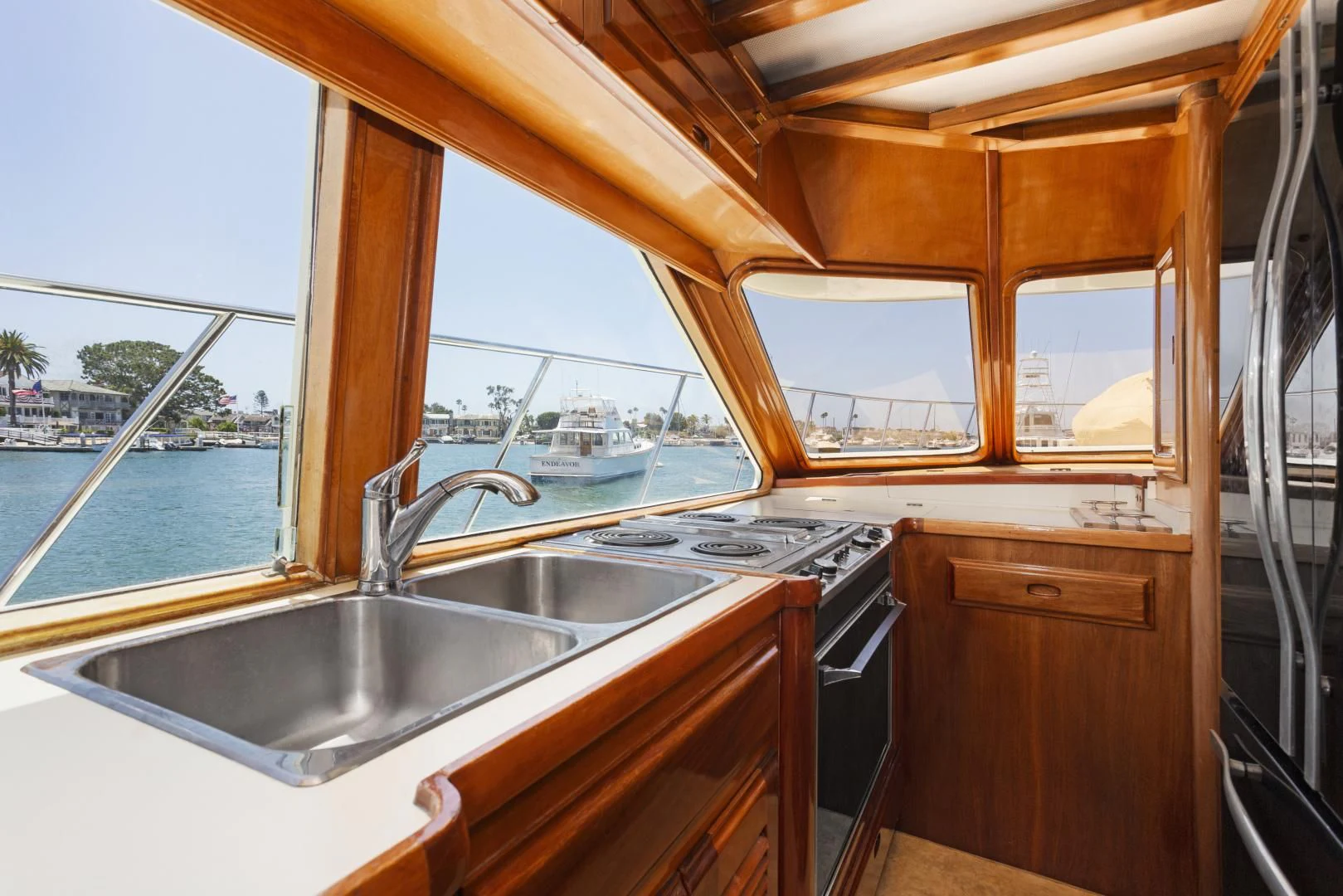 a kitchen with a sink and a window aboard EL AMO Yacht for Sale