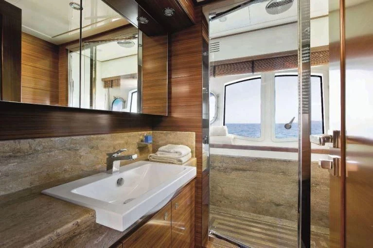 a bathroom with a sink and a mirror aboard BAMBINA Yacht for Sale