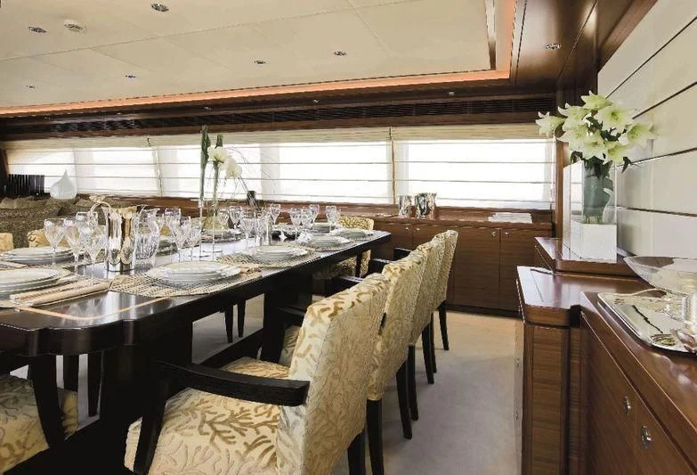 a dining room with a table and chairs aboard BAMBINA Yacht for Sale