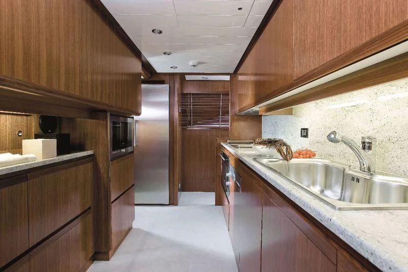 a kitchen with a sink and cabinets aboard BAMBINA Yacht for Sale