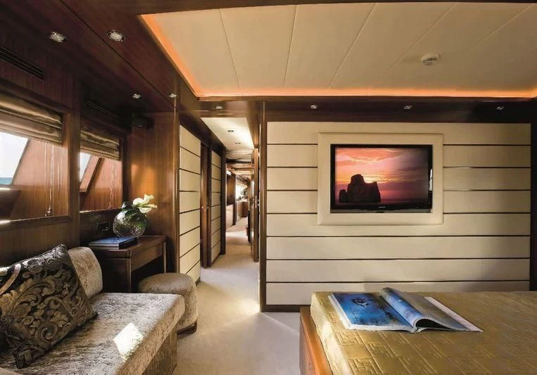 a living room with a large television aboard BAMBINA Yacht for Sale
