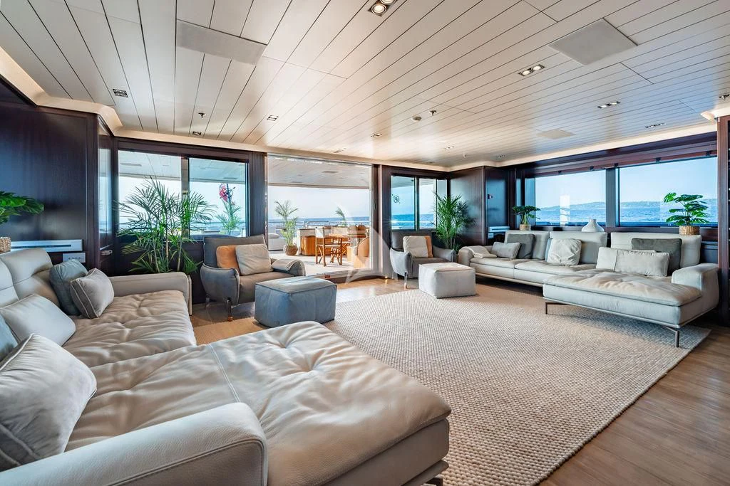 a living room with a large open floor plan aboard GALILEO Yacht for Sale