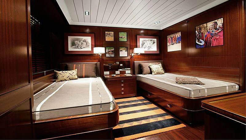 a room with a bed and a desk aboard GALILEO Yacht for Sale