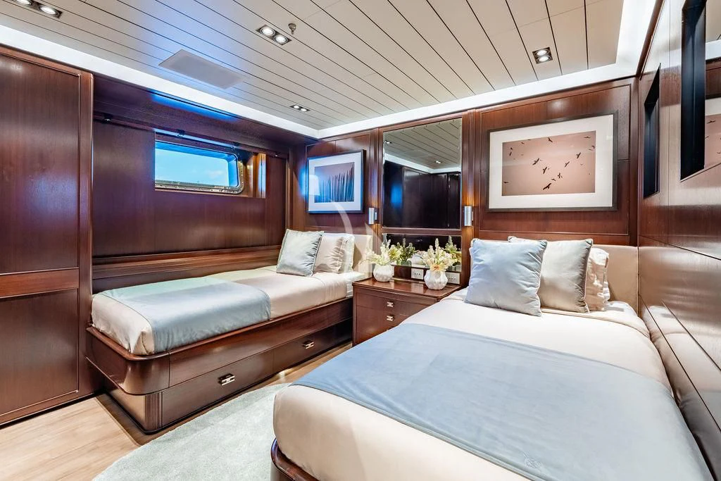 a room with a bed and a window aboard GALILEO Yacht for Sale