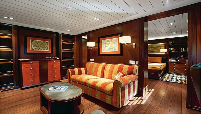 a living room with a couch and a coffee table aboard GALILEO Yacht for Sale