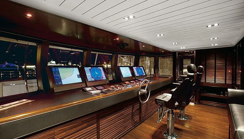 a room with a table and chairs aboard GALILEO Yacht for Sale