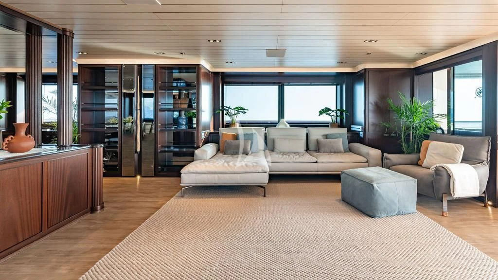 a room with a couch and a table aboard GALILEO Yacht for Sale