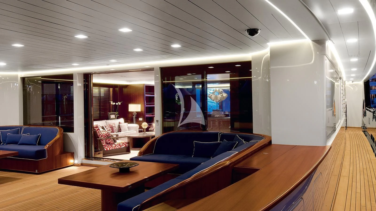 a room with a couch and a table aboard GALILEO Yacht for Sale