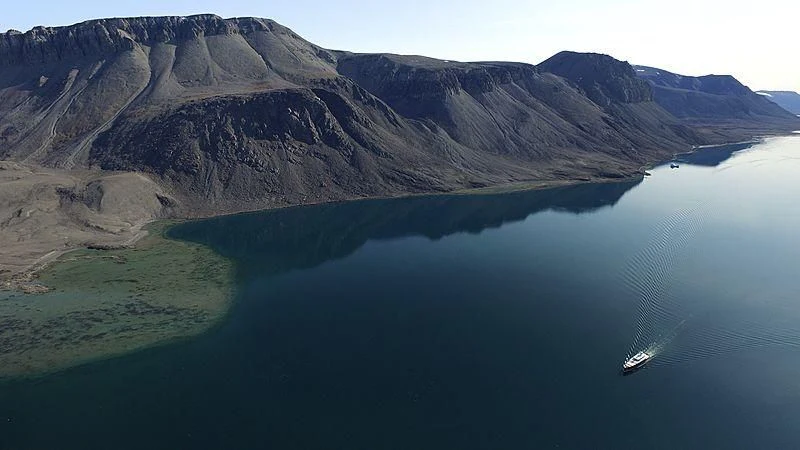 a large body of water with mountains in the background aboard GALILEO Yacht for Sale