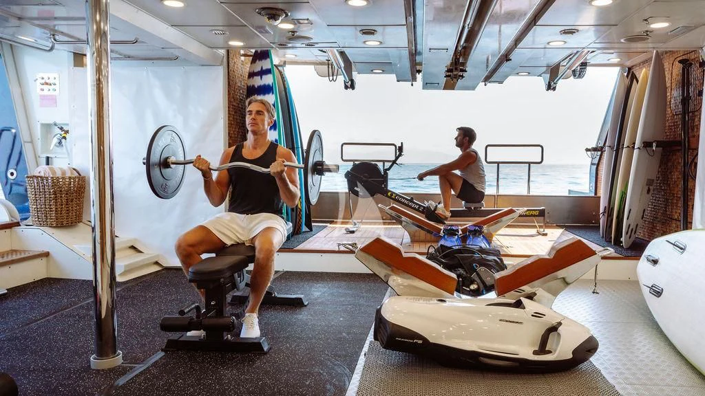 a person working out in a gym aboard GALILEO Yacht for Sale