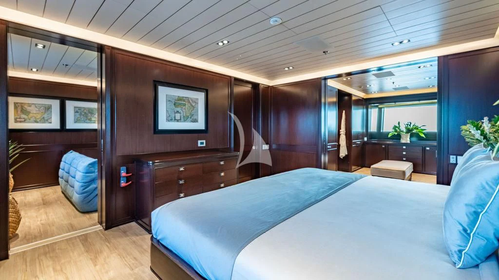 a room with a bed and a desk aboard GALILEO Yacht for Sale