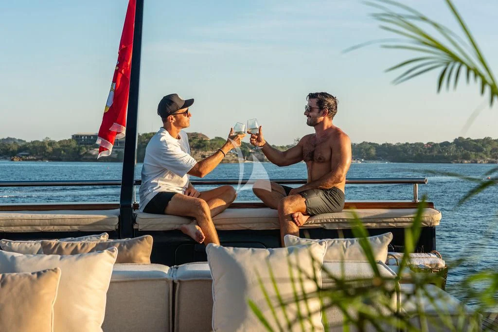 two men sitting on a boat aboard GALILEO Yacht for Sale