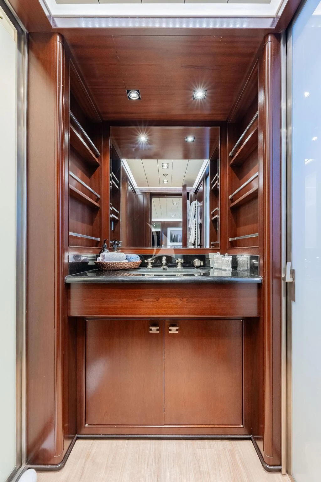a kitchen with wooden cabinets aboard GALILEO Yacht for Sale