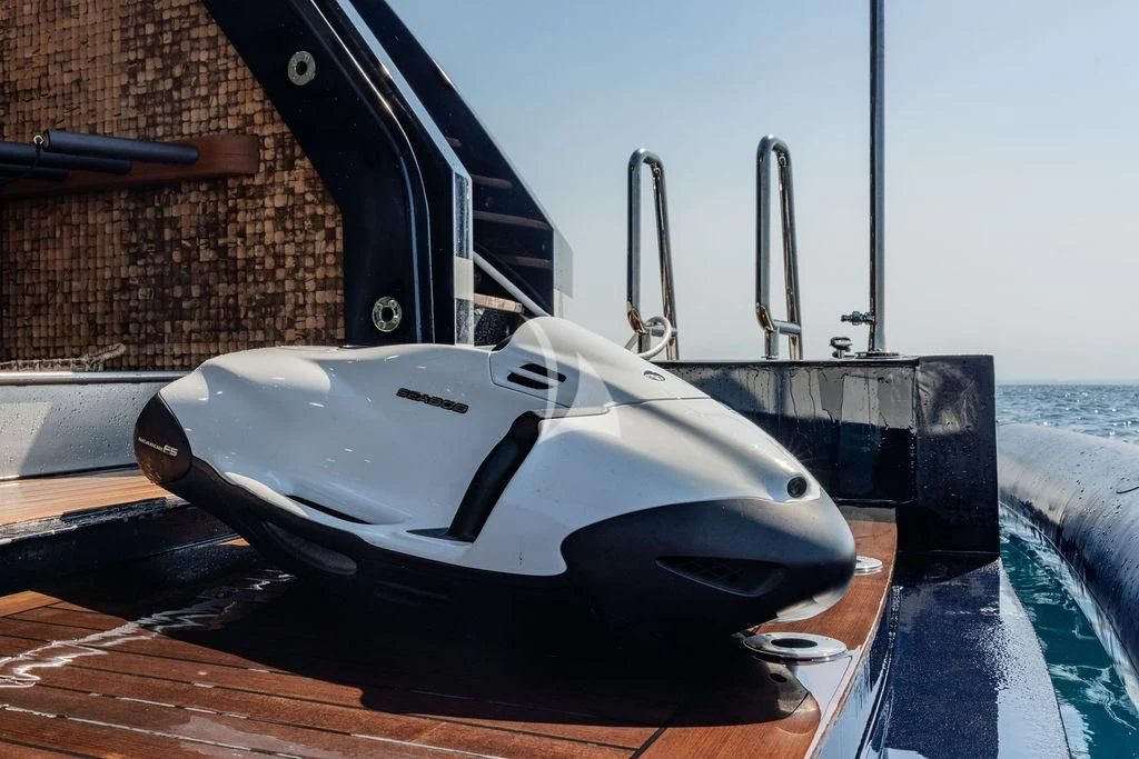 a white and black boat on a deck aboard GALILEO Yacht for Sale